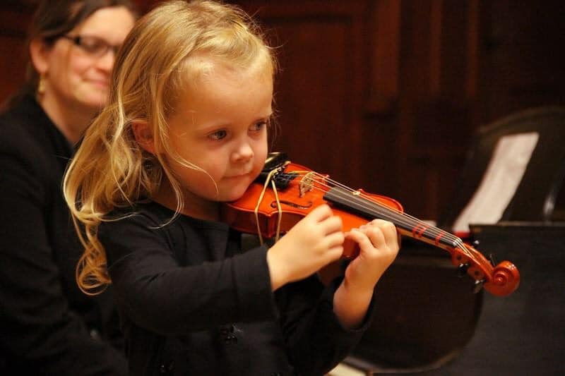 Young girl playing violin