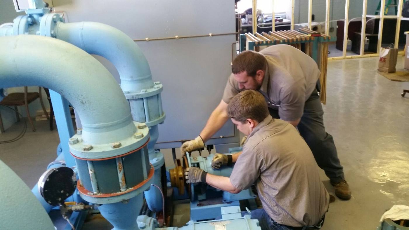 City employee work on pumps at water treatment plant